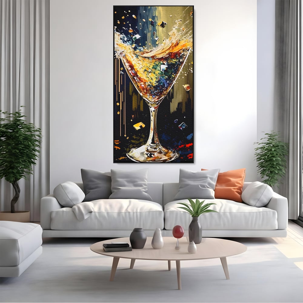 Tablou canvas cu tablou canvas cu pahar de cocktail in plina explozie de culori, in rama de aluminiu negru, pe perete intr-un living